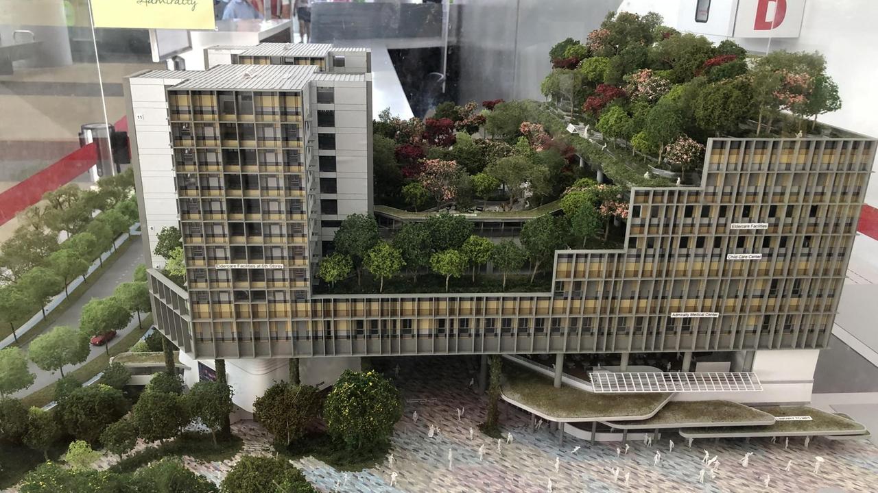 Foto vom Modell eines Hochhauskomplexes mit vielen grünen Oasen Foto vom Modell eines Hochhauskomplexes mit vielen grünen Oasen