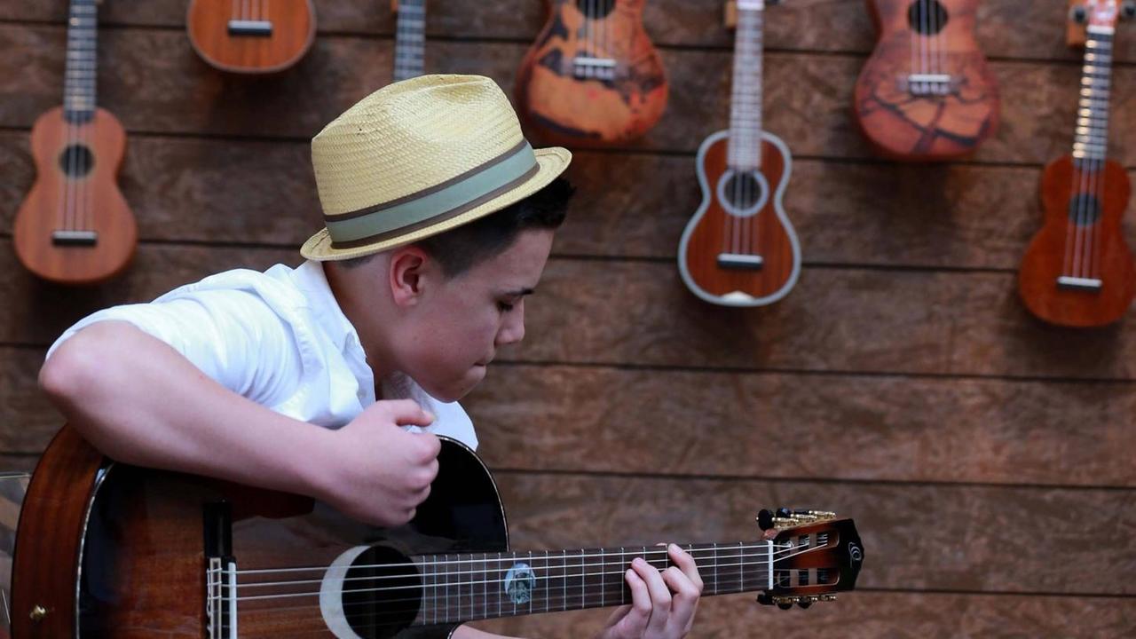(170406) -- FRANKFURT, April 6, 2017 -- A boy plays the guitar at the Musikmesse in Frankfurt, Germany on April 5, 2017. Musikmesse is the international trade fair for musical instruments, sheet music, music production and marketing. ) (zxj) GERMANY-FRANKFURT-MUSIC-TRADE FAIR LuoxHuanhuan PUBLICATIONxNOTxINxCHN Frankfurt April 6 2017 a Boy PLAYS The Guitar AT The Music Fair in Frankfurt Germany ON April 5 2017 Music Fair IS The International Trade Fair for Musical Instruments Sheet Music Music Production and Marketing Germany Frankfurt Music Trade Fair LuoxHuanhuan PUBLICATIONxNOTxINxCHN