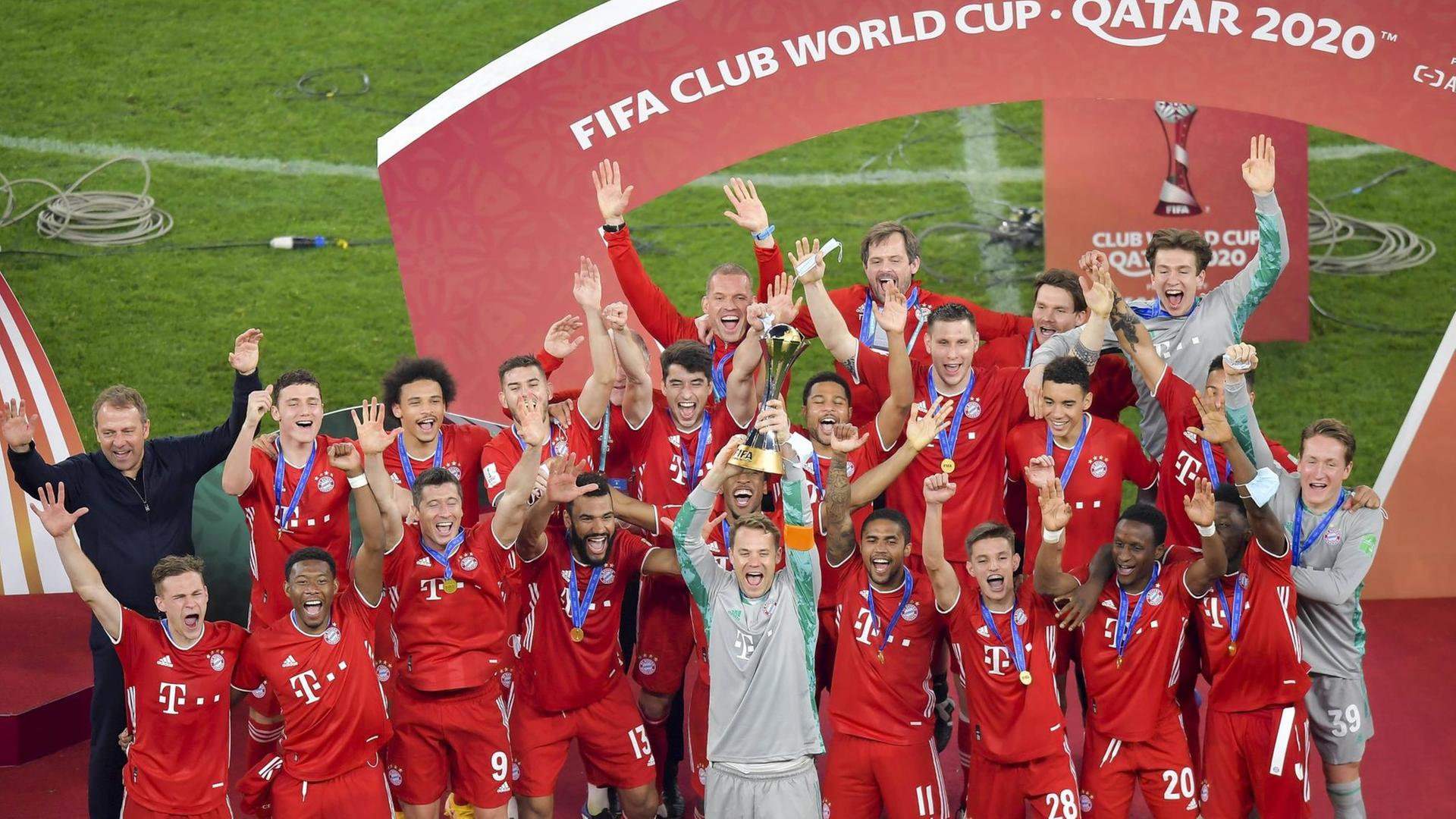 210212 -- DOHA, Feb. 12, 2021 -- Bayern s goalkeeper Manuel Neuer front holds up the trophy as players of Bayern Munich celebrate with the trophy after winning the FIFA Club World final match between Germany s Bayern Munich and Mexico s Tigres Uanl at the Education City Stadium in Doha, Qatar, Feb. 11, 2021. Photo by /Xinhua SPQATAR-DOHA-FIFA CLUB WORLD CUP-BAYERN MUNICH VS TIGERS UANL Nikku PUBLICATIONxNOTxINxCHN