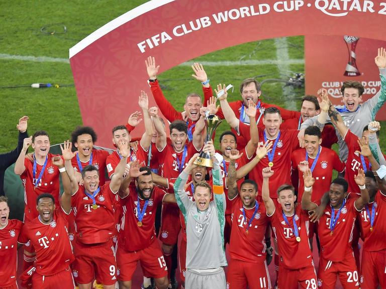 210212 -- DOHA, Feb. 12, 2021 -- Bayern s goalkeeper Manuel Neuer front holds up the trophy as players of Bayern Munich celebrate with the trophy after winning the FIFA Club World final match between Germany s Bayern Munich and Mexico s Tigres Uanl at the Education City Stadium in Doha, Qatar, Feb. 11, 2021. Photo by /Xinhua SPQATAR-DOHA-FIFA CLUB WORLD CUP-BAYERN MUNICH VS TIGERS UANL Nikku PUBLICATIONxNOTxINxCHN