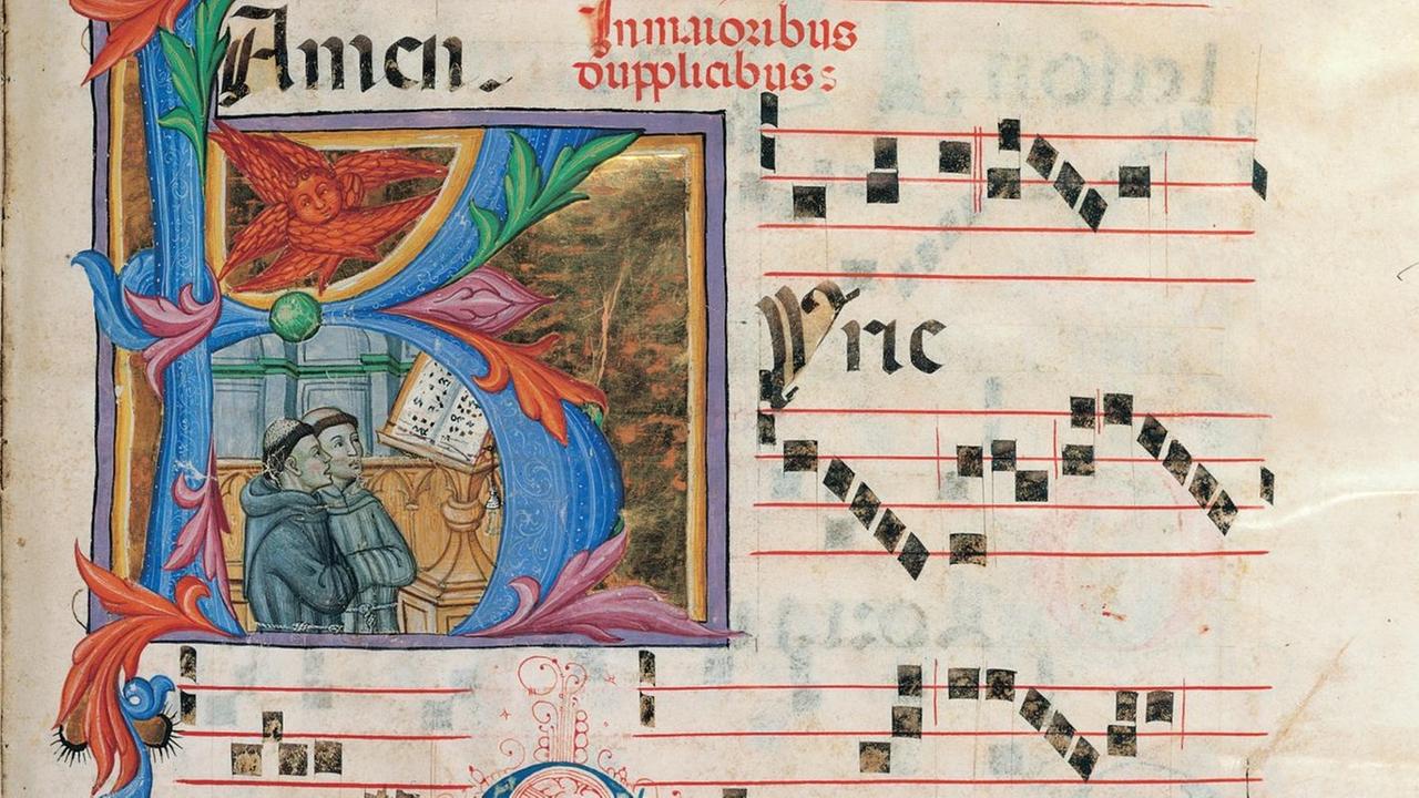 Verzierte Seite eines Chorbuches mit liturgischem Gesang, mit einer kleinen Illustration zweier Mönchsfiguren. Verzierte Seite eines Chorbuches mit liturgischem Gesang, mit einer kleinen Illustration zweier Mönchsfiguren.