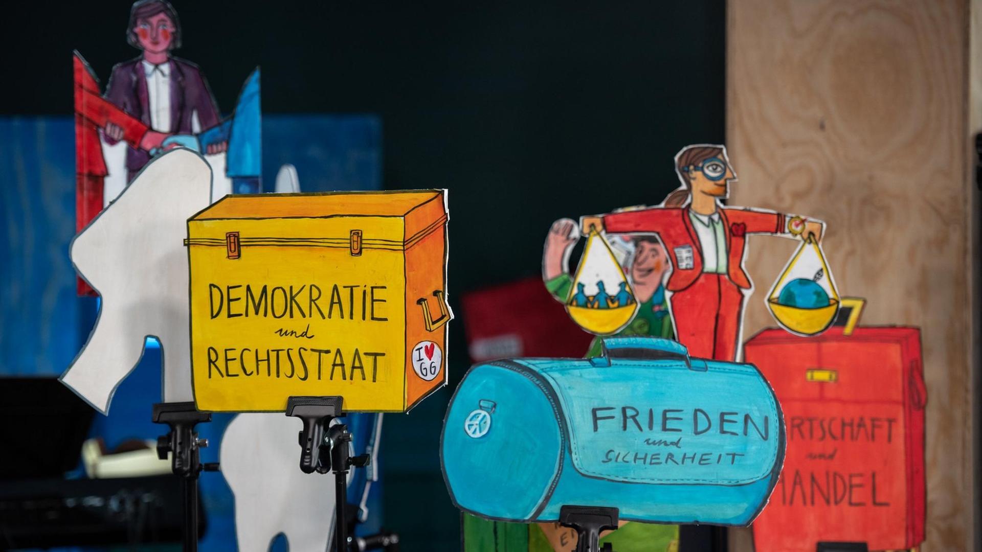 Die Schwerpunkte vom digitalen Bürgerrat "Deutschlands Rolle in der Welt" zusammengefasst als bunte Illustrationen von Alexandra Klobouk. Die Schwerpunkte vom digitalen Bürgerrat "Deutschlands Rolle in der Welt" zusammengefasst als bunte Illustrationen von Alexandra Klobouk.