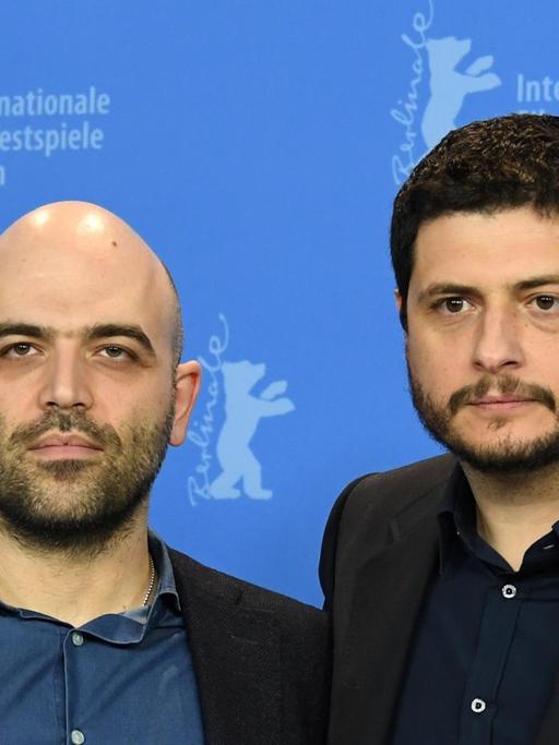 Der Schriftsteller Roberto Saviano (li.) und der Regisseur Claudio Giovannesi bei einem Photocall zum Film "Piranhas" auf der Berlinale 2019.