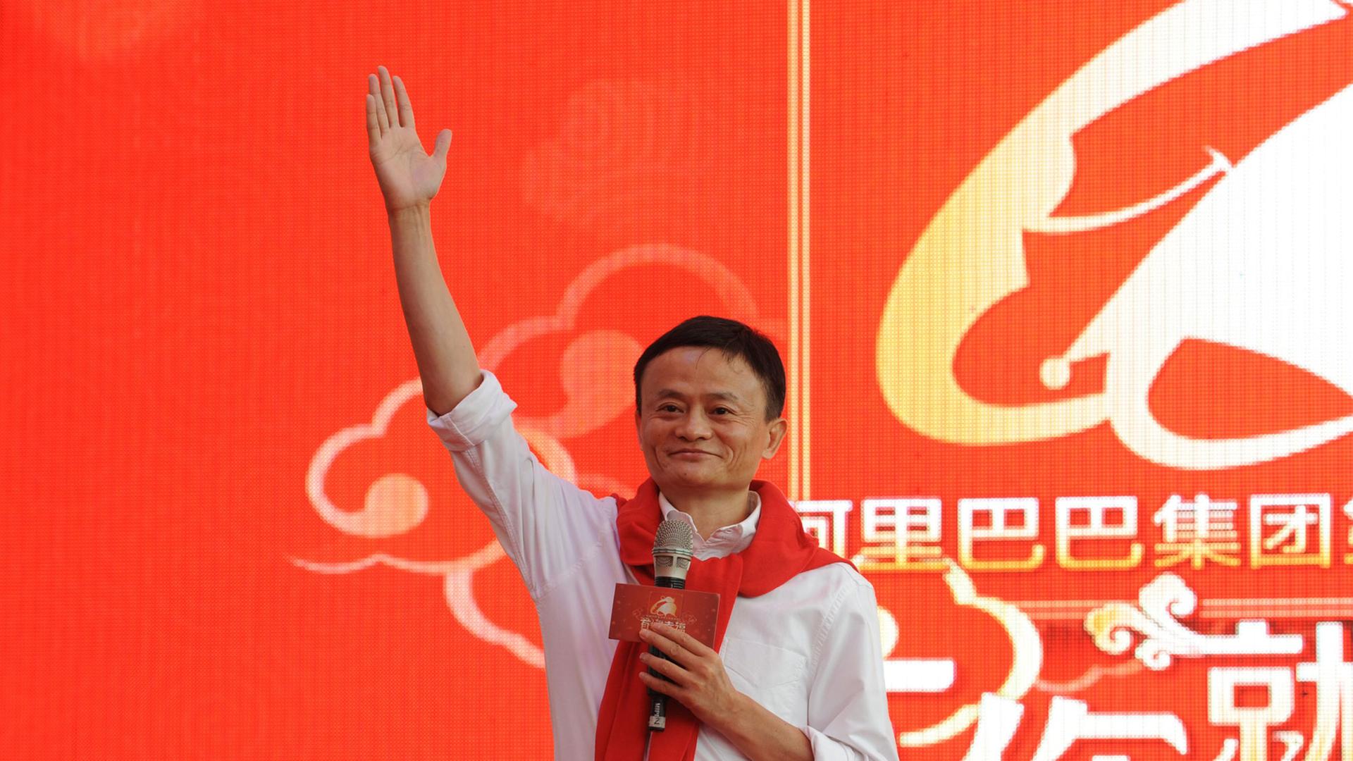 Jack Ma, chairman of Alibaba Group, witnesses a group wedding ceremony on May 9, 2014 in Hangzhou, Zhejiang Province of China