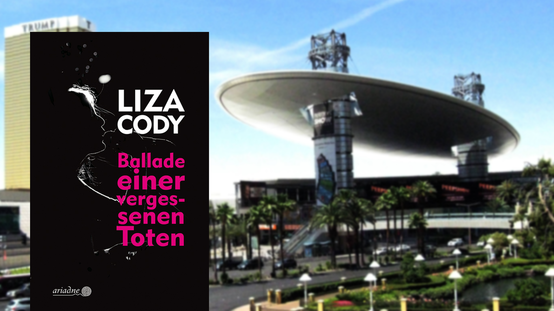 Im Vordergrund ist das Buchcover Ballade einer vergessenen Toten zu sehen. Im Hintergrund ein Einkaufszentrum in Las Vegas, das ein futuristische Architektur hat. Im Vordergrund ist das Buchcover Ballade einer vergessenen Toten zu sehen. Im Hintergrund ein Einkaufszentrum in Las Vegas, das ein futuristische Architektur hat.