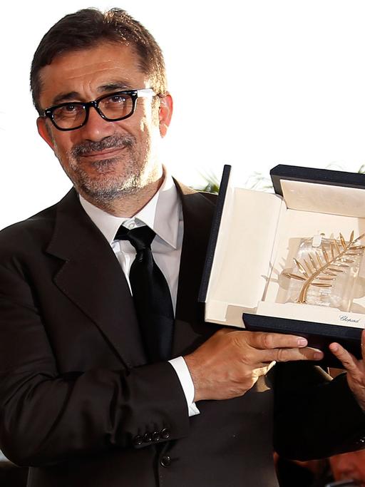 Turkish director Nuri Bilge Ceylan poses during the Award Winners photocall after he won the Palme d'Or (Golden Palm) award for his movie 'Winter Sleep' at the 67th annual Cannes Film Festival in Cannes, France