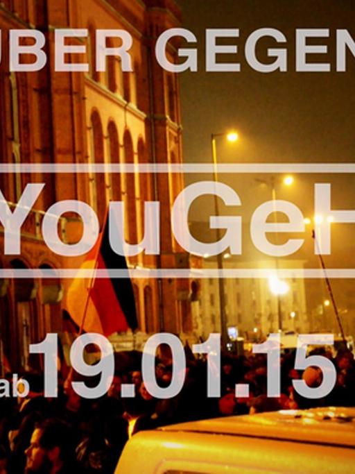 Screenshot des offiziellen #YouGeHa-Trailers. Schrift auf dem Foto von einer Pegida-Demonstration: Youtuber gegen Hass - #YouGeHa - am 19.01.15