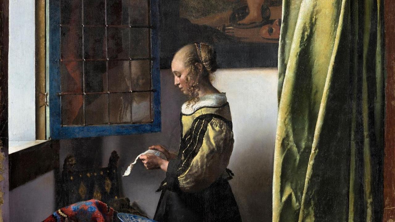 Ein Mädchen steht an einem Fenster und liest einen Brief, Bild von Vermeer. Ein Mädchen steht an einem Fenster und liest einen Brief, Bild von Vermeer.