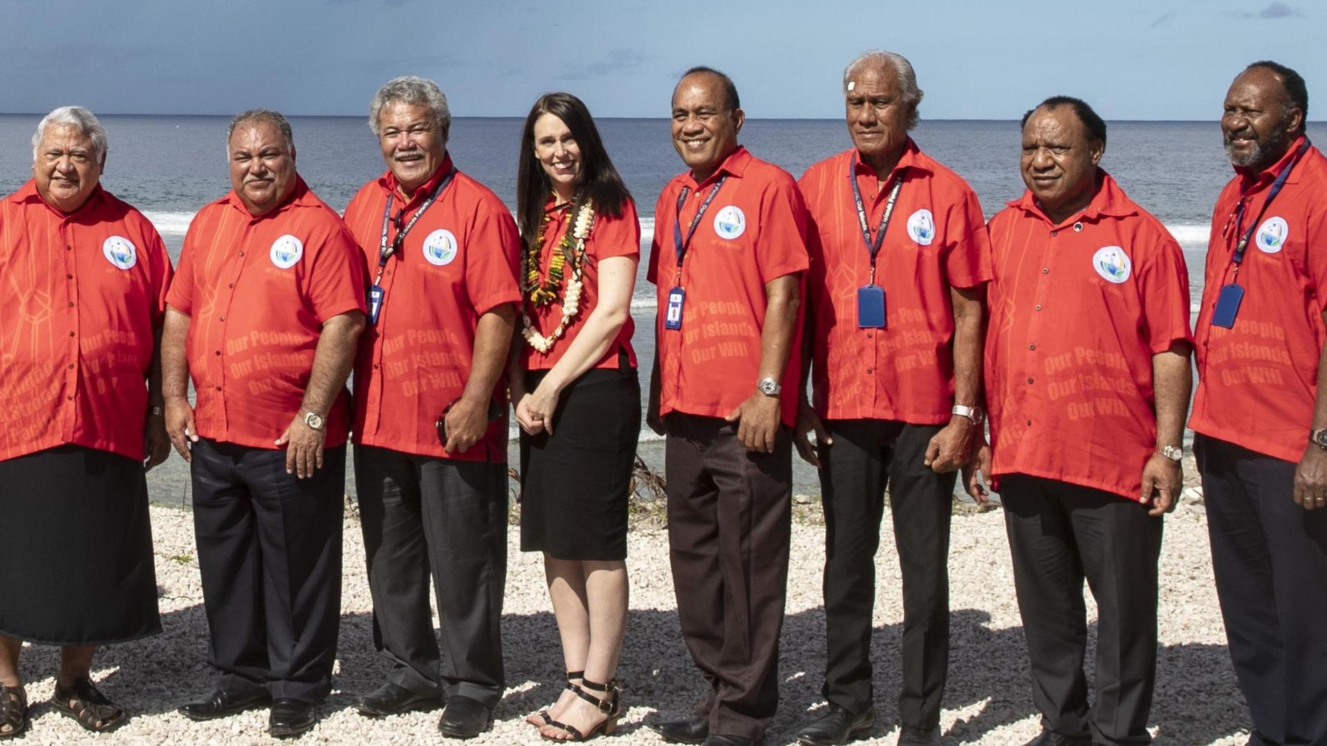 Nauru President Baron Waqa, second from left, poses with New Zealand Prime Minister Jacinda Ardern, fourth from left and other Pacific leaders for a group photo during the Pacific Islands Forum in Nauru, Wednesday, Sept. 5, 2018. (Jason Oxenham/Pool Photo via AP)