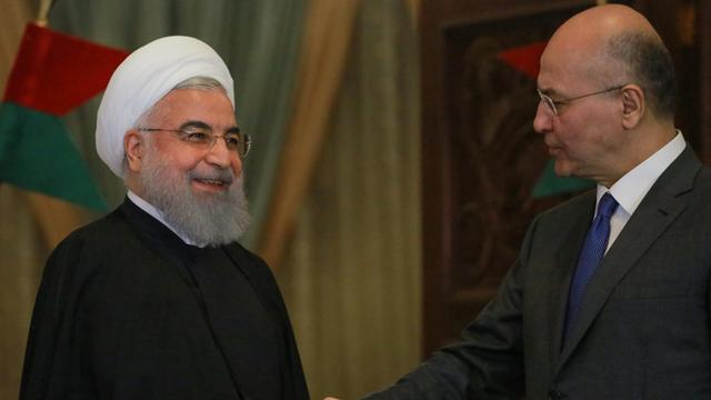 Hassan Ruhani (l), Präsident des Iran, auf einer Pressekonferenz mit Barham Salih (r), Präsident des Irak im MÄrz 2019. Es ist der erste Besuch Ruhanis in Irak als Präsident.
