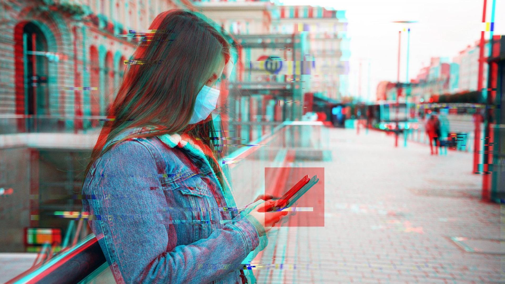 Eine Frau lehnt an einem Geländer und schaut auf ihr Handy. Das Bild ist schwarz/weiß mit einer Verschiebung von Rot- und Blauebene. Um das Smartphone ist ein rotes transparentes Quadrat. Eine Frau lehnt an einem Geländer und schaut auf ihr Handy. Das Bild ist schwarz/weiß mit einer Verschiebung von Rot- und Blauebene. Um das Smartphone ist ein rotes transparentes Quadrat.