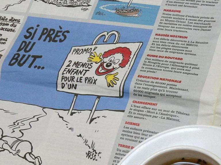 Karikatur des bekannten Fotos mit dem ertrunkenen Flüchtlingsjungen in der französischen Satire-Zeitschrift "Charlie Hebdo".