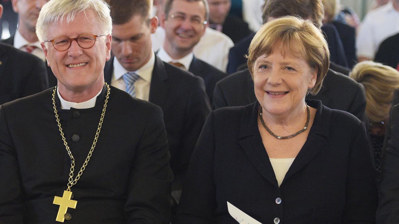 Der EKD-Ratsvorsitzende Heinrich Bedford-Strohm und Bundeskanzlerin Angela Merkel Der EKD-Ratsvorsitzende Heinrich Bedford-Strohm und Bundeskanzlerin Angela Merkel
