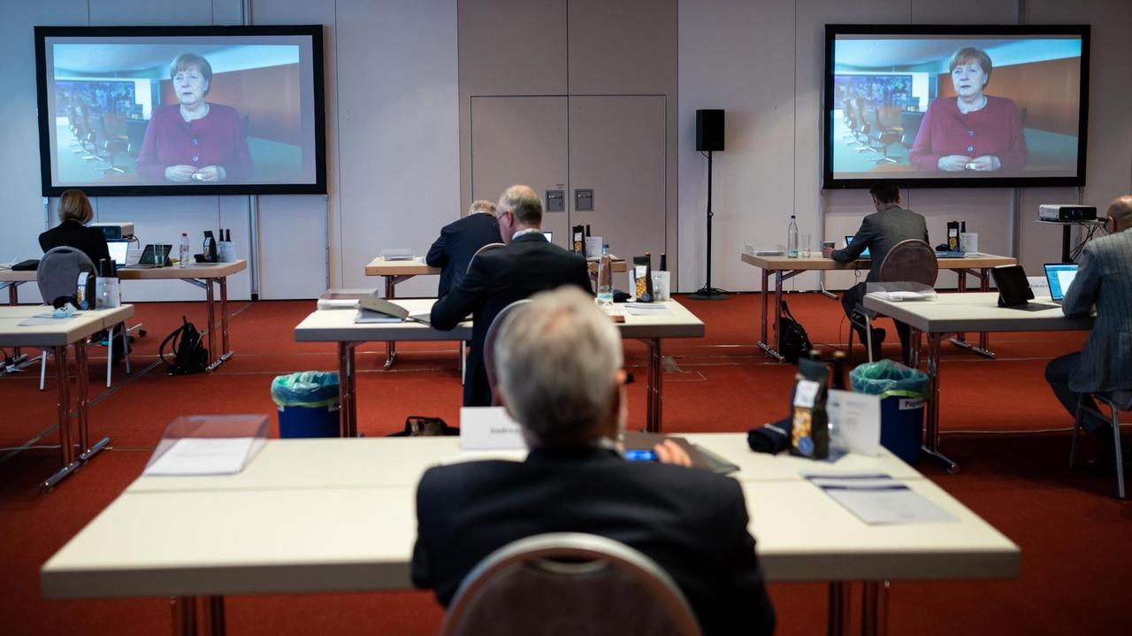 Bundeskanzlerin Merkel äußert sich in einer Videobotschaft auf dem Deutschen Ärztetag. Bundeskanzlerin Merkel äußert sich in einer Videobotschaft auf dem Deutschen Ärztetag.