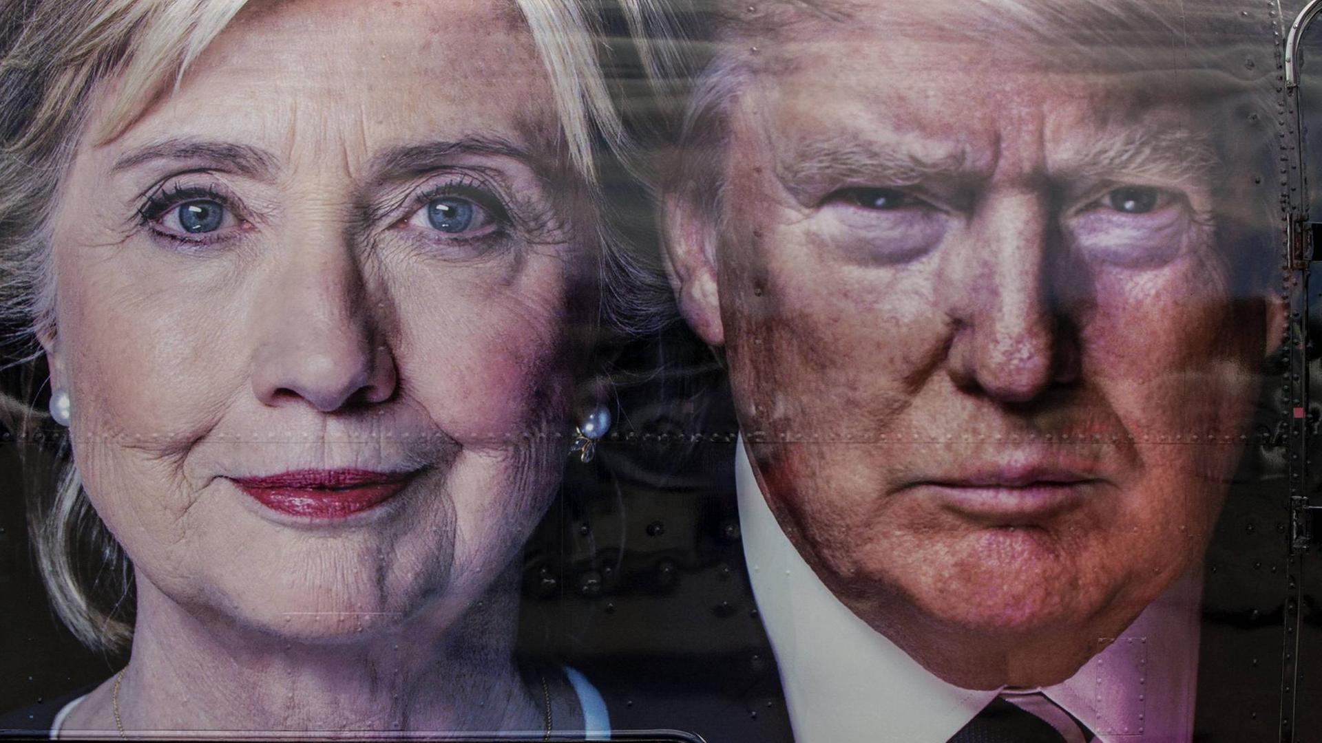 Auf einem CNN Übertragungswagen sind die Porträts von Hillary Clinton (l.) und Donald Trump (r.) zu sehen.
