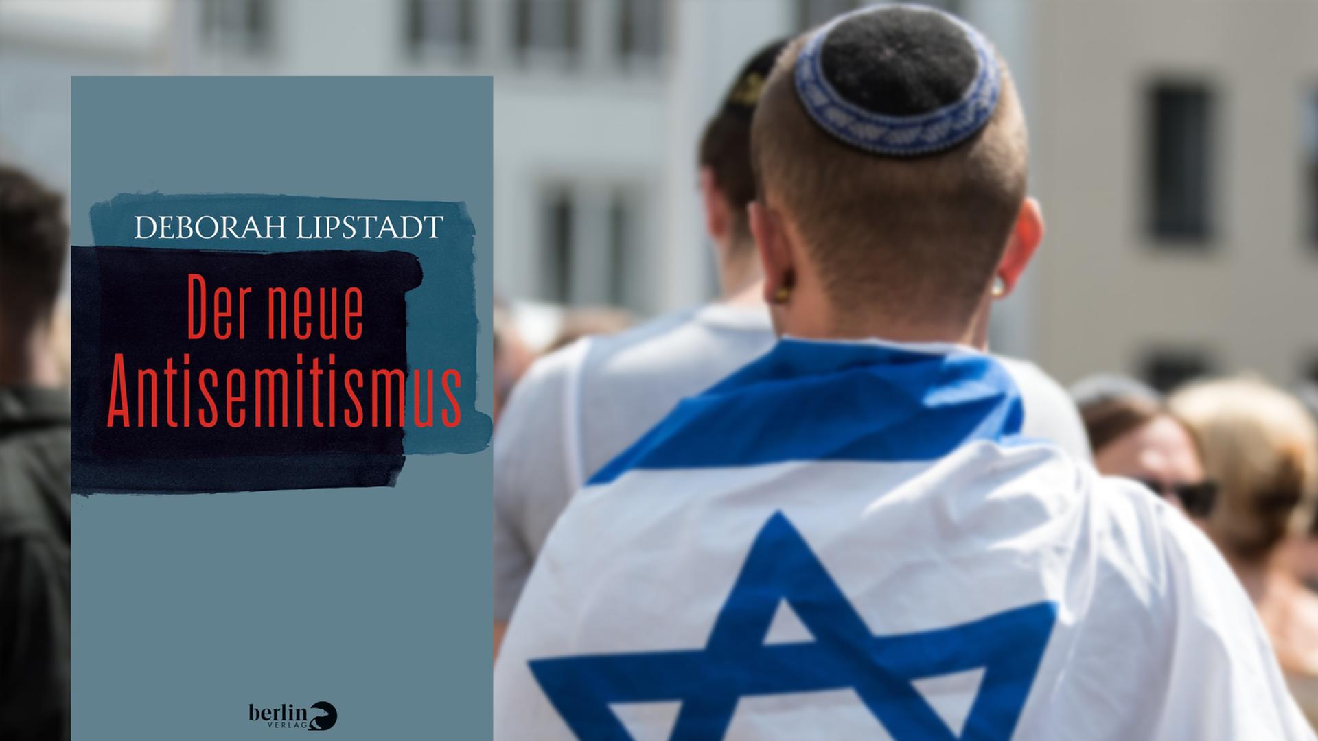 Ein Mann hat eine Israelfahne über seine Schultern gelegt und trägt eine Kippa Ein Mann hat eine Israelfahne über seine Schultern gelegt und trägt eine Kippa