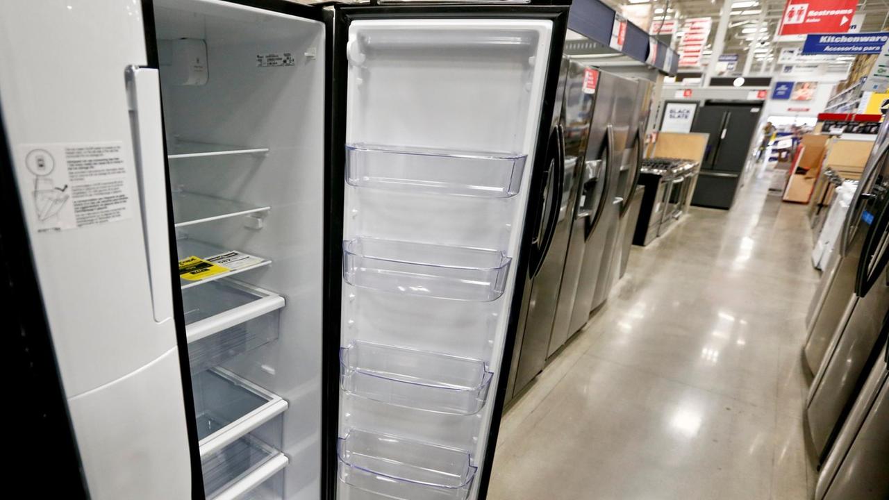 A selection of refigerators are available for sale at a big box store in Cranberry Township, USA, April 11, 2018. A U.N.-backed report claims making air conditioners and fridges more energy efficient and using more climate-friendly refrigerants can significantly slow global warming. (AP Photo/Keith Srakocic)