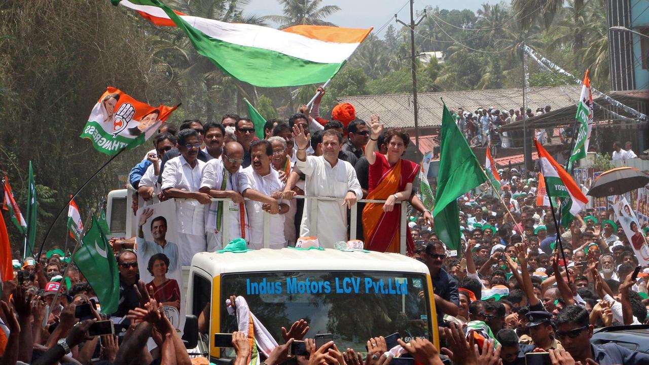 Rahul Gandhi, President of India's main opposition Congress party, and his sister a leader of Congress party Priyanka Gandhi Vadra, wave to their supporters after Rahul filed his nomination papers for the general election, in Wayanad in the southern state of Kerala, India, April 4, 2019. REUTERS/Stringer NO RESALES. NO ARCHIVES TPX IMAGES OF THE DAY
