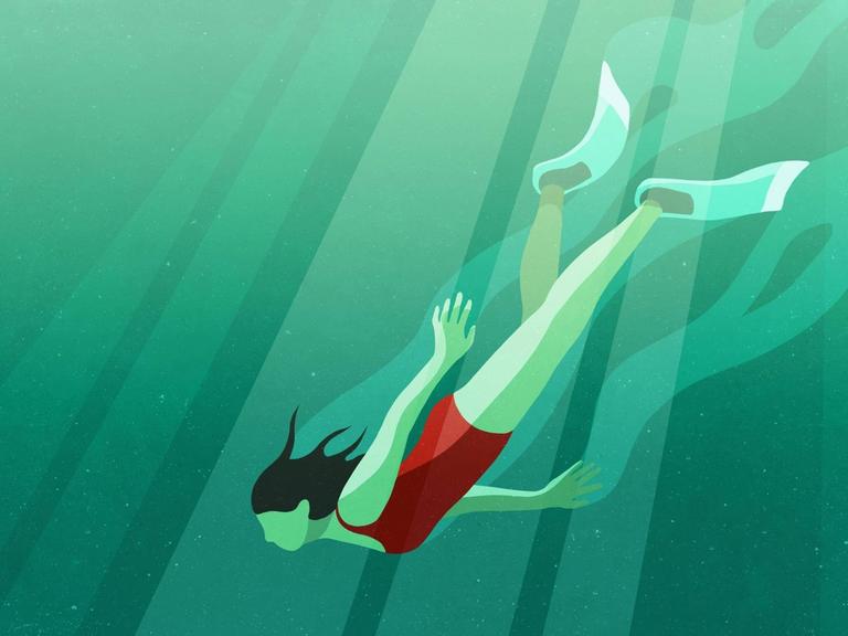 Eine Frau taucht unter Wasser.