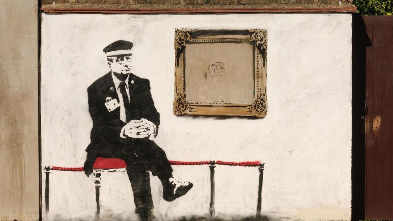 Museum guard, by the Street Artist Banksy, Martineau Road, London, N5, Britain. Museum guard, by the Street Artist Banksy, Martineau Road, London, N5, Britain.