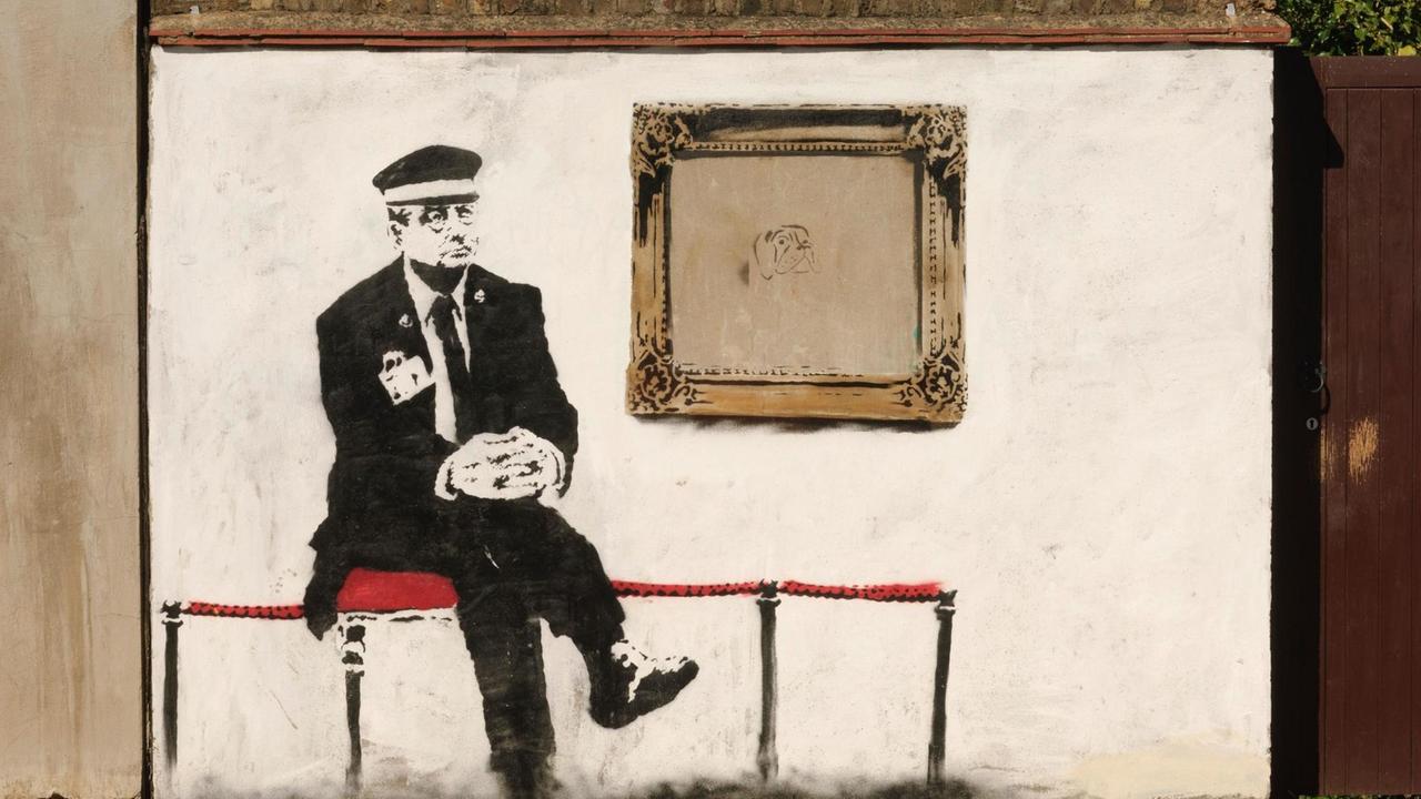 Museum guard, by the Street Artist Banksy, Martineau Road, London, N5, Britain. Museum guard, by the Street Artist Banksy, Martineau Road, London, N5, Britain.