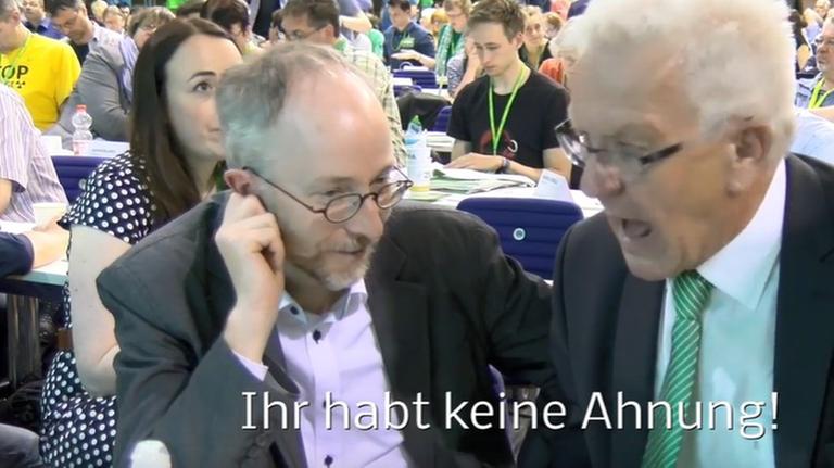 Das Bild zeigt eine Szene aus dem umstrittenen Video, in dem Baden-Württembergs Ministerpräsident Kretschmann (Grüne) dem Parteikollegen Gastel "Ihr habt keine Ahnung" zuruft (Die Untertitel stammen von den Autoren des auf Youtube veröffentlichten Beitrags). Das Bild zeigt eine Szene aus dem umstrittenen Video, in dem Baden-Württembergs Ministerpräsident Kretschmann (Grüne) dem Parteikollegen Gastel "Ihr habt keine Ahnung" zuruft (Die Untertitel stammen von den Autoren des auf Youtube veröffentlichten Beitrags).