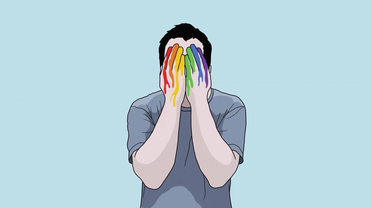Eine Illustration zeigt einen Mann, der sein Gesicht mit den Händen verdeckt. Diese sind in Regenbogenfaben bemalt. Eine Illustration zeigt einen Mann, der sein Gesicht mit den Händen verdeckt. Diese sind in Regenbogenfaben bemalt.
