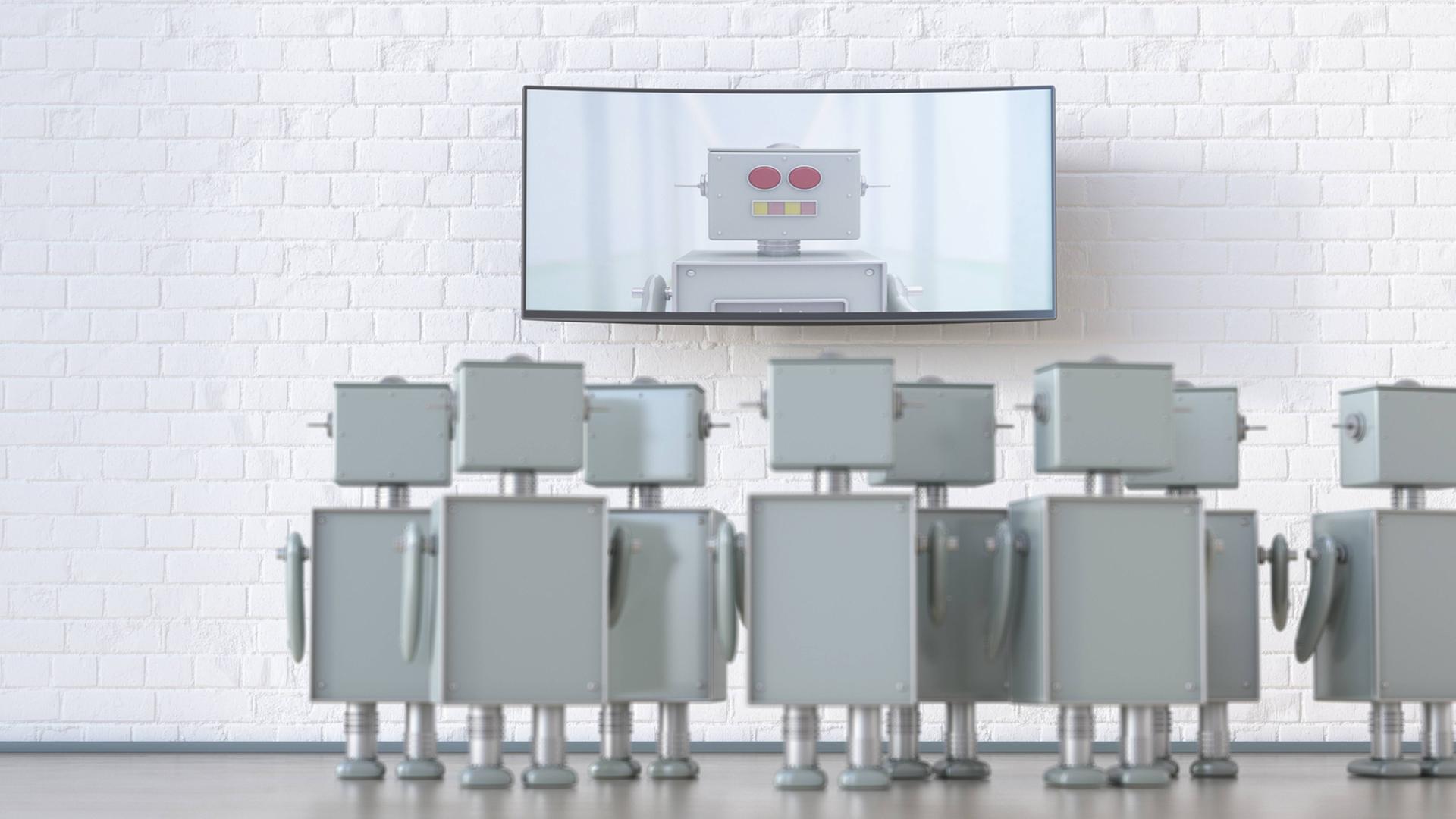 Eine Gruppe von Robotern blickt auf einen Bildschirm mit einem Roboter Eine Gruppe von Robotern blickt auf einen Bildschirm mit einem Roboter