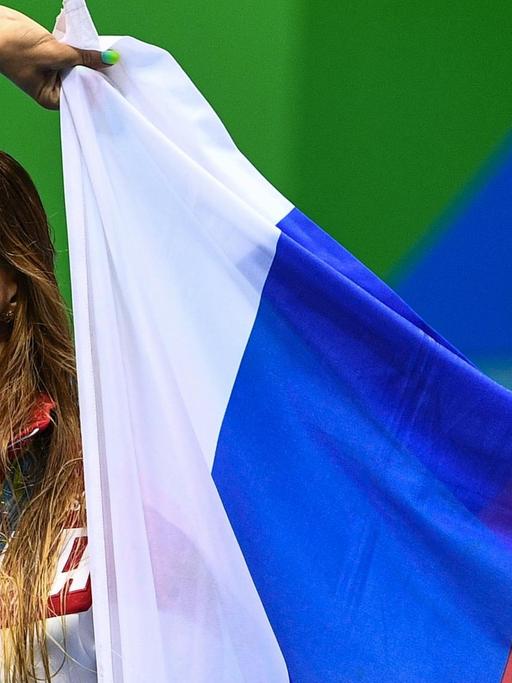2910386 08/11/2016 Yulia Yefimova (Russia), winner of the silver medal in the women's individual 200m breaststroke at the XXXI Summer Olympics, during the award ceremony. Alexander Vilf/Sputnik |
