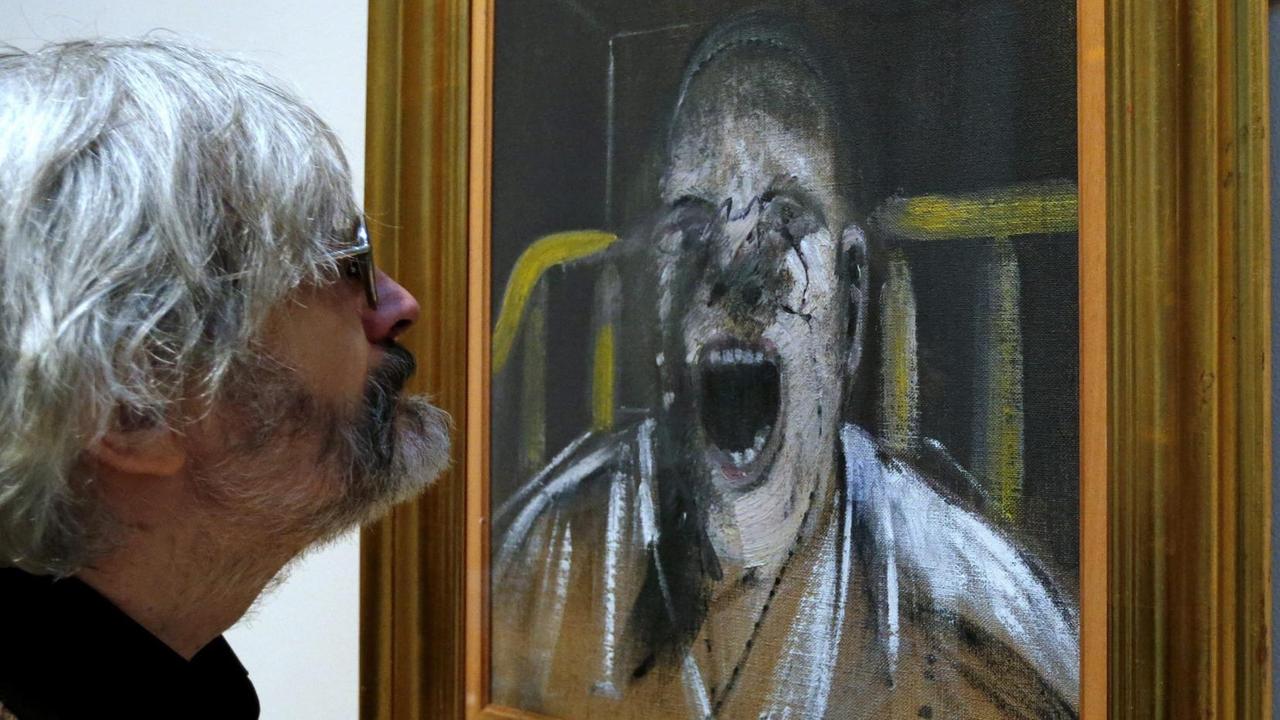 epa04517293 A visitor looks at the artwork 'Study for the Head of a Screaming Pope. 1952' by Irish artist Francis Bacon during his exhibition at the Hermitage State museum in St. Petersburg, Russia, 06 December 2014. Displayed in the exhibition are over twenty works by Bacon (1909-1992) from public museums and private collections in Great Britain, Ireland and the United States. EPA/ANATOLY MALTSEV | epa04517293 A visitor looks at the artwork 'Study for the Head of a Screaming Pope. 1952' by Irish artist Francis Bacon during his exhibition at the Hermitage State museum in St. Petersburg, Russia, 06 December 2014. Displayed in the exhibition are over twenty works by Bacon (1909-1992) from public museums and private collections in Great Britain, Ireland and the United States. EPA/ANATOLY MALTSEV |