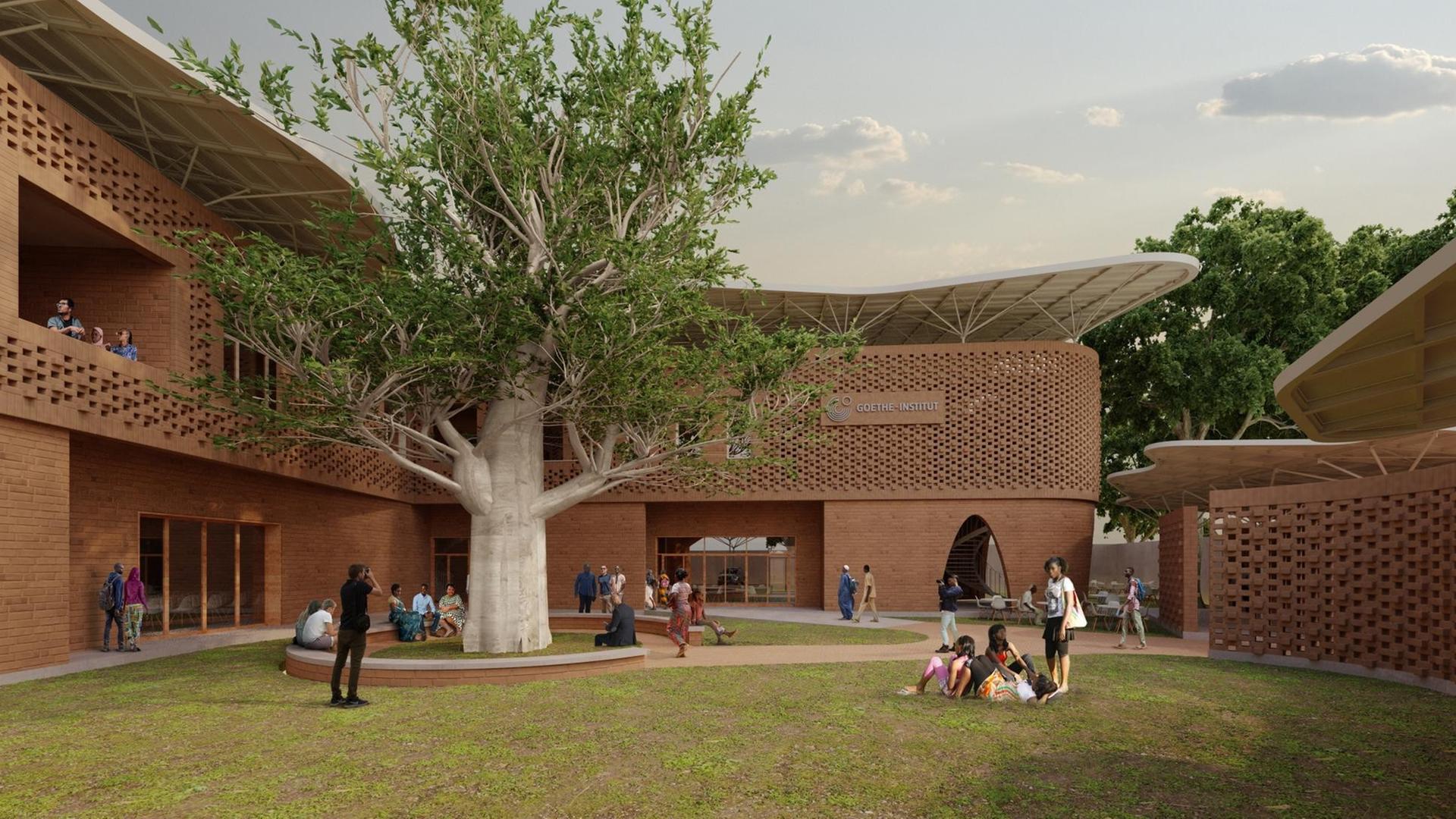 Außenansicht des Goethe-Instituts Senegal mit Besuchern auf der Wiese vor dem Gebäude. Außenansicht des Goethe-Instituts Senegal mit Besuchern auf der Wiese vor dem Gebäude.