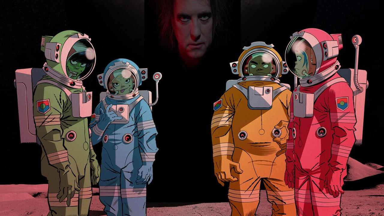 Die Comicfiguren der Gorillaz stehen in Raumanzügen auf dem Mond. Im Hintergrund ist die Erde zu sehen. Die Comicfiguren der Gorillaz stehen in Raumanzügen auf dem Mond. Im Hintergrund ist die Erde zu sehen.