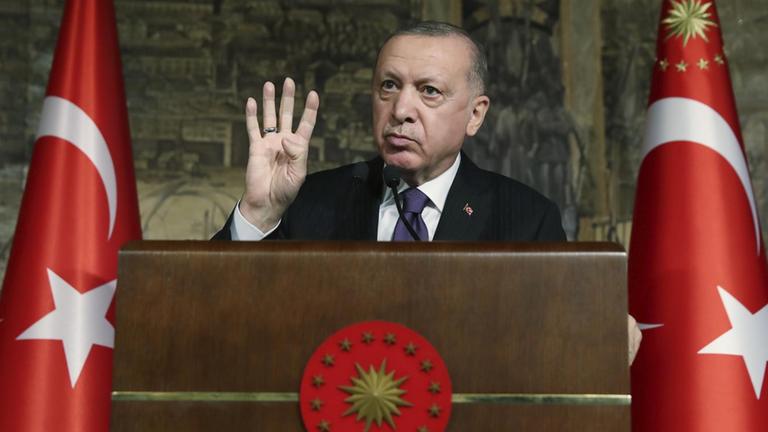 Turkey's President Recep Tayyip Erdogan speaks during a meeting, in Istanbul, Friday, Jan. 15, 2021. Erdogan indicated on Friday that he would be open to easing tensions with neighboring Greece by floating the possibility of a face-to-face meeting with the Greek prime minister following months of saber-rattling over energy resources in the Eastern Mediterranean. (Turkish Presidency via AP, Pool)