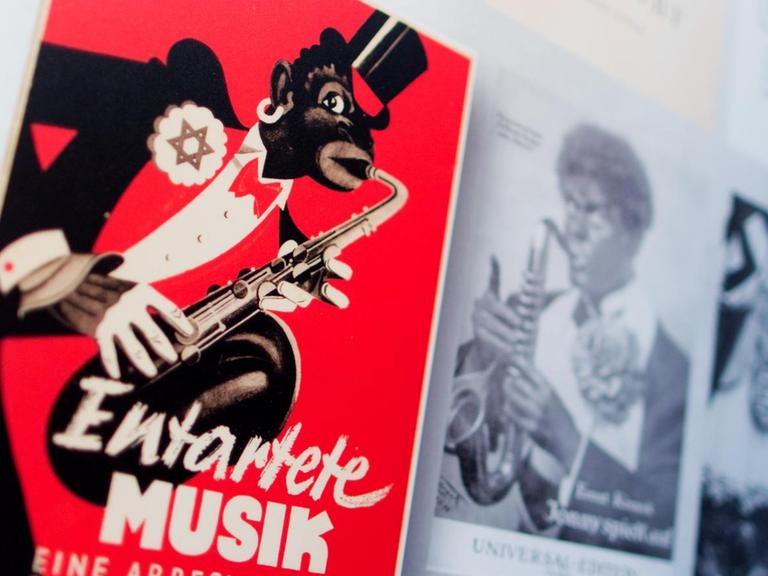 Das verzerrte Bild eines Saxophonspielers, der einen Judenstern trägt und afrikanische Züge trägt, wurde das Symbol von "Entartete Musik" in der Zeit des Nationalsozialismus.