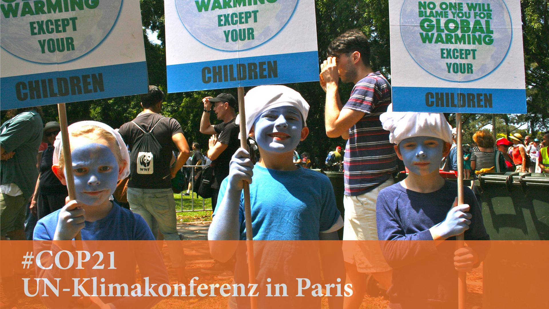 Für besseren Klimaschutz demonstrieren drei als Schlümpfe verkleidete australische Kinder am 29. November 2015 in Sydney. Für besseren Klimaschutz demonstrieren drei als Schlümpfe verkleidete australische Kinder am 29. November 2015 in Sydney.