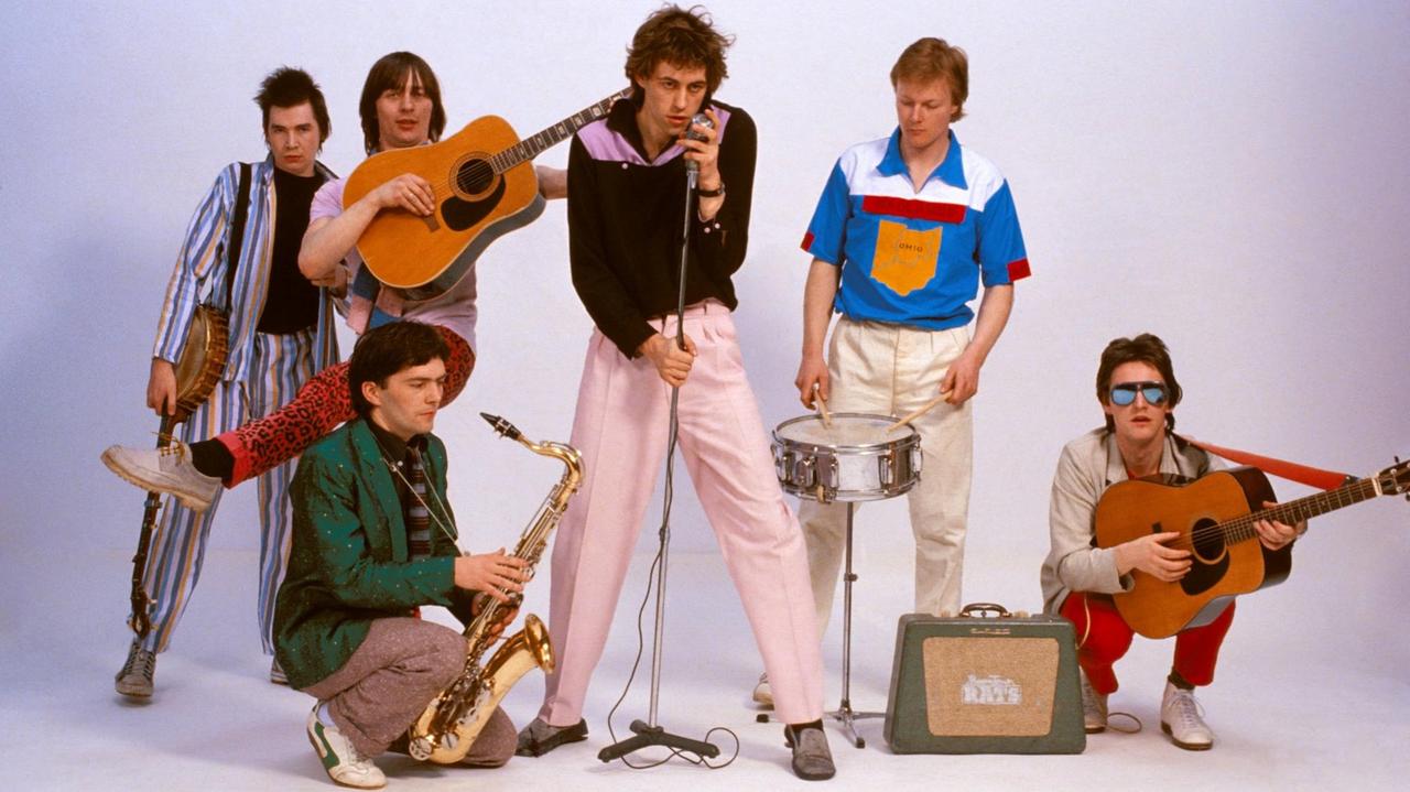UNITED KINGDOM - APRIL 01: Photo of Pete BRIQUETTE and Johnnie FINGERS and Gerry COTT and Garry ROBERTS and BOOMTOWN RATS and Bob GELDOF and Simon CROWE (Photo by Fin Costello/Redferns)