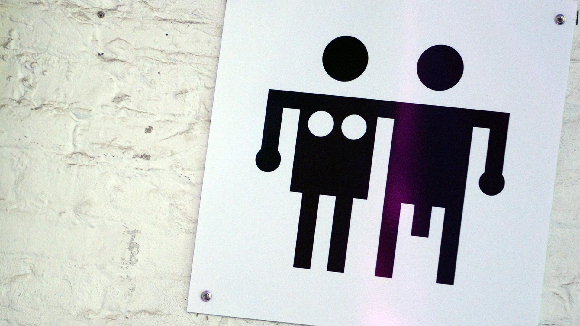 Ein Piktogramm für Männer- und Frauen-Toiletten Ein Piktogramm für Männer- und Frauen-Toiletten