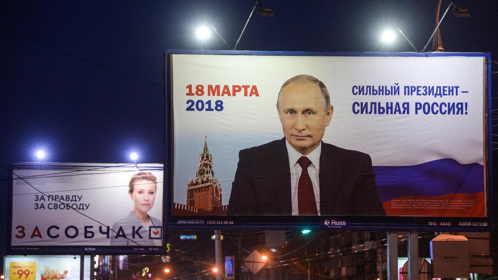 3305812 02/20/2018 Election campaign posters in Novosibirsk. Alexandr Kryazhev/Sputnik Foto: Alexandr Kryazhev/Sputnik/dpa | 3305812 02/20/2018 Election campaign posters in Novosibirsk. Alexandr Kryazhev/Sputnik Foto: Alexandr Kryazhev/Sputnik/dpa |