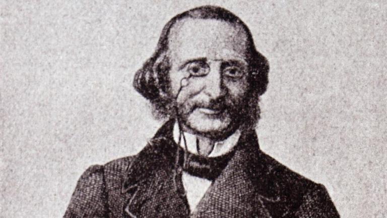 Ein Porträt von Jacques Offenbach. Er trägt einen langen Mantel, auf der Nase seinen Zwicker. Ein Porträt von Jacques Offenbach. Er trägt einen langen Mantel, auf der Nase seinen Zwicker.