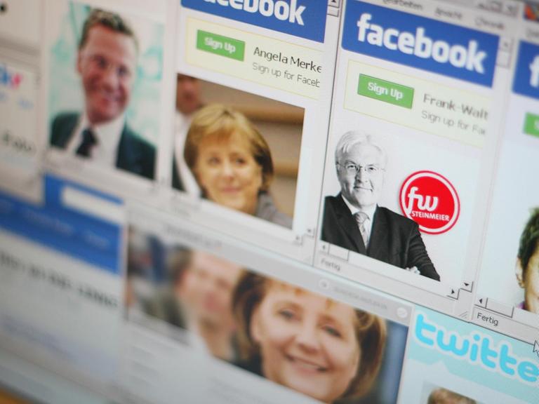 Auf einem Computermonitor sind Facebook- und Twitter-Profile von verschiedenen Politikern zu sehen.