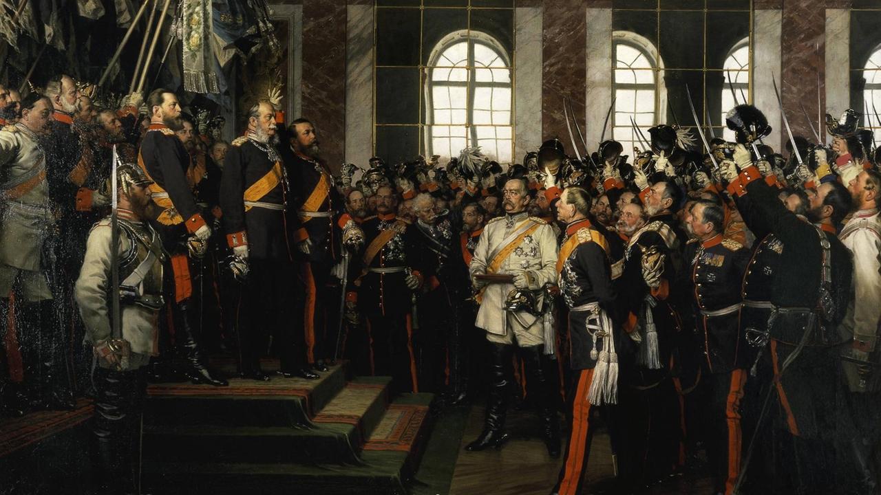 18. Januar 1871: König Wilhelm I. von Preußen wird im Spiegelsaal des Schlosses von Versailles zum Deutschen Kaiser ausgerufen. Die Proklamierung des Deutschen Kaiserreiches. Gemälde, 1885, von Anton von Werner (18431915). Öl auf Leinwand, 167 × 202 cm. (3., sog. Friedrichsruher Fassung). Friedrichsruh, Bismarck-Museum. 18. Januar 1871: König Wilhelm I. von Preußen wird im Spiegelsaal des Schlosses von Versailles zum Deutschen Kaiser ausgerufen. Die Proklamierung des Deutschen Kaiserreiches. Gemälde, 1885, von Anton von Werner (18431915). Öl auf Leinwand, 167 × 202 cm. (3., sog. Friedrichsruher Fassung). Friedrichsruh, Bismarck-Museum.
