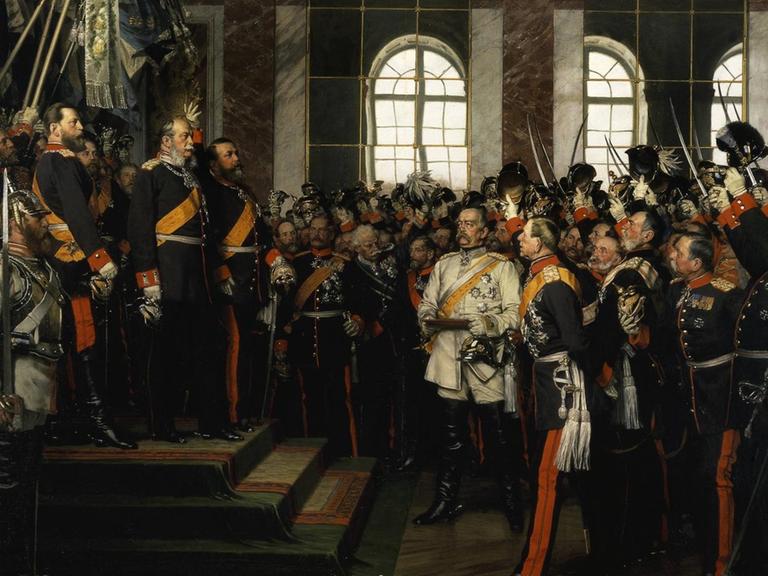 18. Januar 1871: König Wilhelm I. von Preußen wird im Spiegelsaal des Schlosses von Versailles zum Deutschen Kaiser ausgerufen. Die Proklamierung des Deutschen Kaiserreiches. Gemälde, 1885, von Anton von Werner (18431915). Öl auf Leinwand, 167 × 202 cm. (3., sog. Friedrichsruher Fassung). Friedrichsruh, Bismarck-Museum.