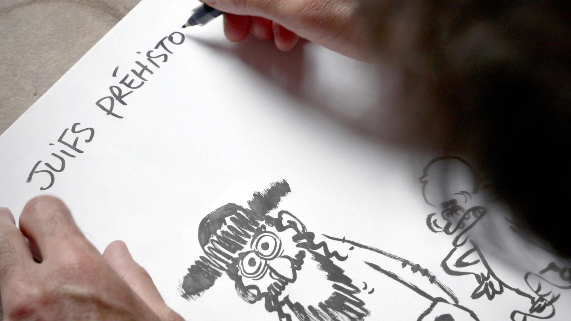 Auf ein Blatt schreibt jemand "Juifs Préhisto...". Weiter unten sind die Karikatur eines orthodoxen Juden und ein Affe zu sehen. Auf ein Blatt schreibt jemand "Juifs Préhisto...". Weiter unten sind die Karikatur eines orthodoxen Juden und ein Affe zu sehen.