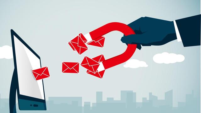 Illustration einer riesigen Hand mit rotem Magnet, die Briefumschläge mit Nachrichten aus einem Computer herauszieht.
