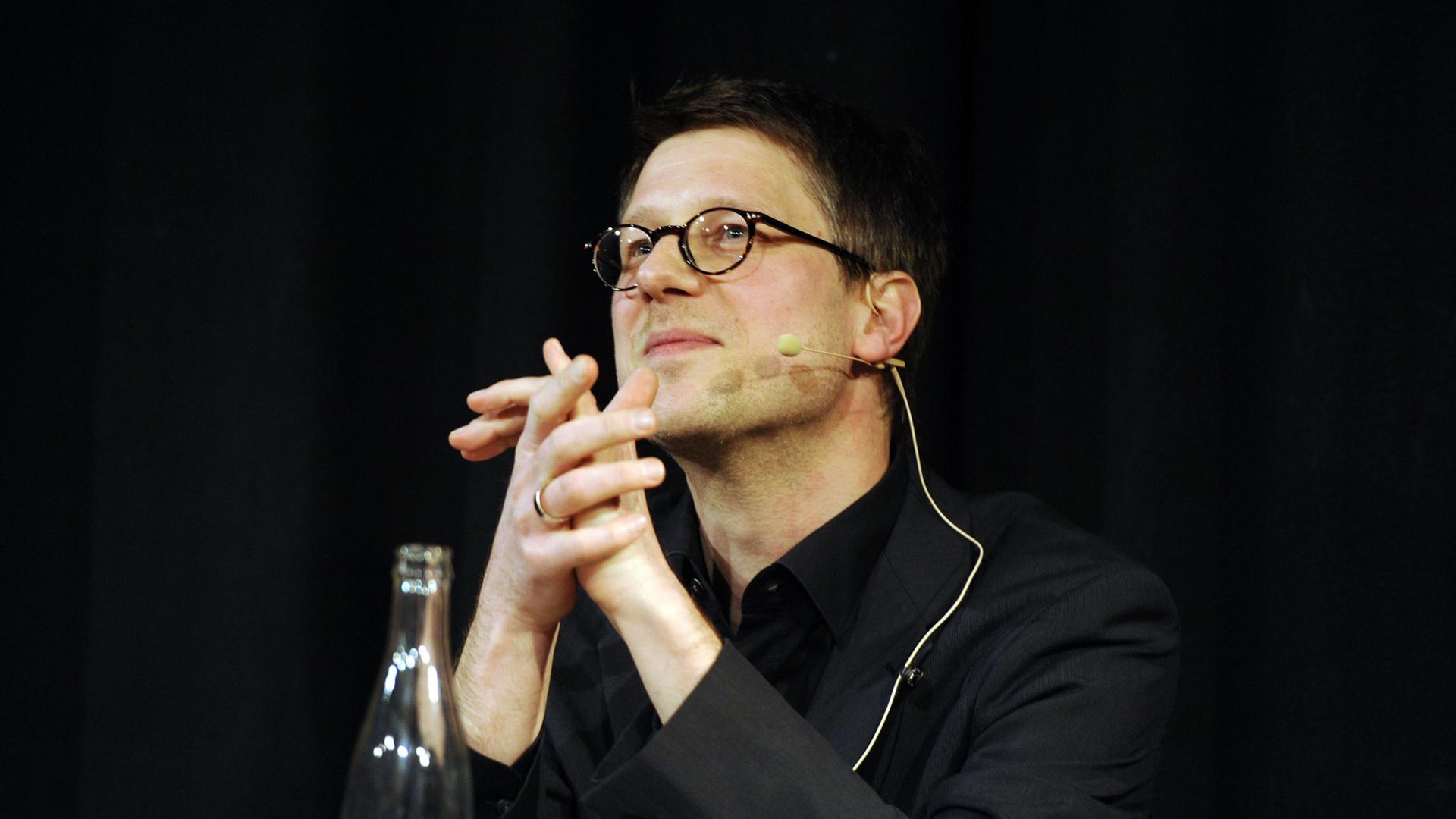 Der Autor Jan Wagner bei einer Lesung in Köln, März 2014 Der Autor Jan Wagner bei einer Lesung in Köln, März 2014