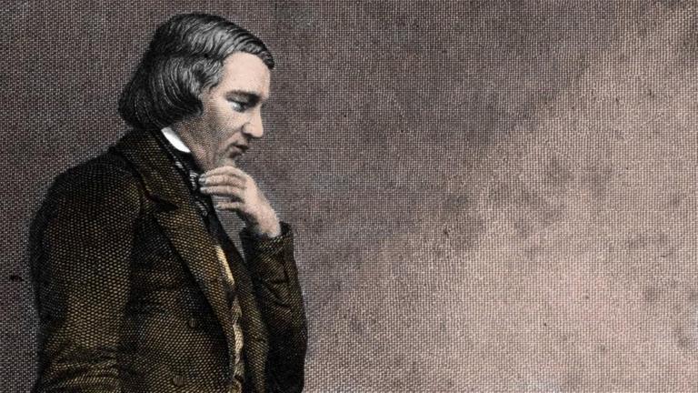 Der Komponist Robert Schumann steht neben seiner Ehefrau, der Pianistin und Komponistin Clara Schumann, sie sitzt am Klavier, er schaut sie an, sie schaut beiseite und scheint den Klängen nachzulauschen. Der Komponist Robert Schumann steht neben seiner Ehefrau, der Pianistin und Komponistin Clara Schumann, sie sitzt am Klavier, er schaut sie an, sie schaut beiseite und scheint den Klängen nachzulauschen.