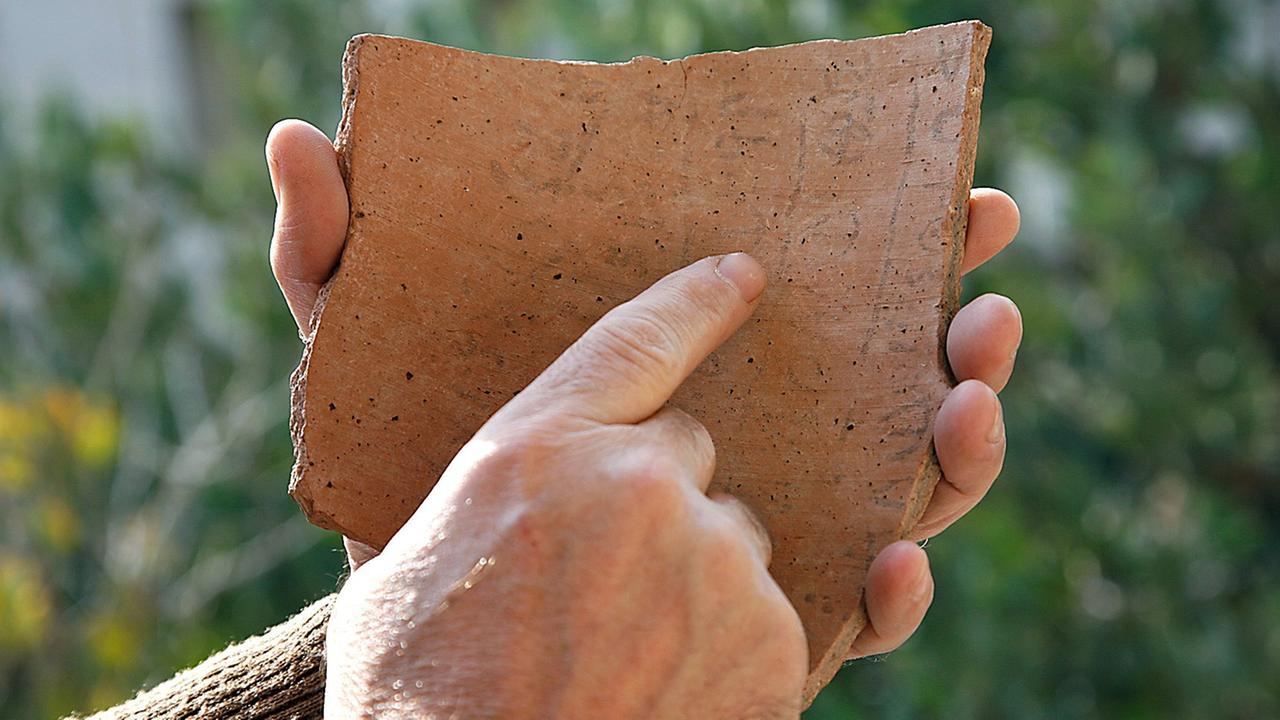 A photograph supplied by the Hebrew University in Jerusalem on 30 October 2008 shows the 'ostracon' with hebrew writing in ink on a ceremaic plaque that was discovered in an archaeological excavation in the Elah Fortress in the Galilee in northern Israel. Archaeologisits say it is the earlies example of Hebrew writing and has been carbon 14 dated to 3,000 years ago, some 1,000 years older than the dead Sea scrolls.The inscription has yet to be deciphered but initial interpretation indicates the text was part of a letter and it contains of the words 'judge', 'slave' and 'king.' 
