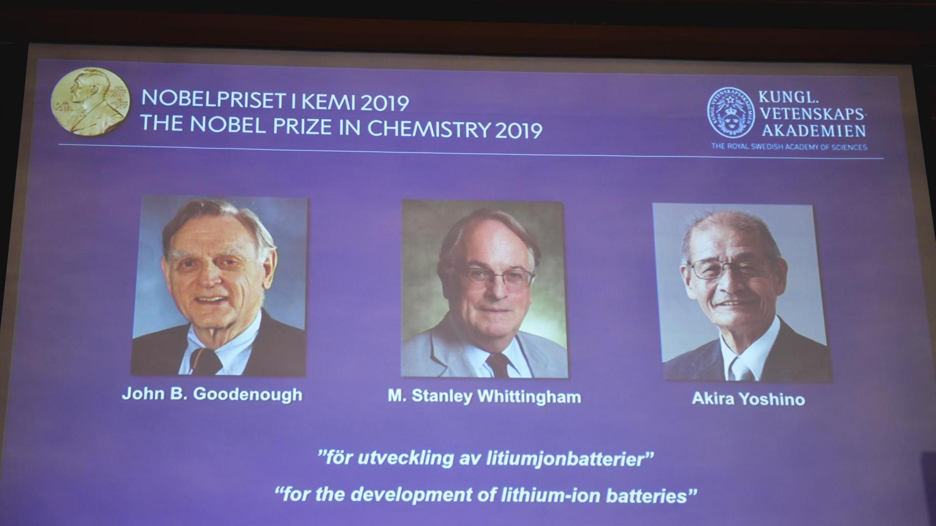 A screen displays the portraits of the laureates of the 2019 Nobel Prize in Chemistry (L-R) John Goodenough of US, Britain's Stanley Whittingham and Japan's Akira Yoshino during a press conference at the Royal Swedish Academy of Sciences in Stockholm, Sweden, on October 9, 2019. - John Goodenough of US, Britain's Stanley Whittingham and Japan's Akira Yoshino won the 2019 Nobel Chemistry Prize for the development of lithium-ion batteries, the Royal Swedish Academy of Sciences said. "This lightweight, rechargeable and powerful battery is now used in everything from mobile phones to laptops and electric vehicles...(and) can also store significant amounts of energy from solar and wind power, making possible a fossil fuel-free society," the jury said. (Photo by Naina Helen JAMA / TT News Agency / AFP) / Sweden OUT