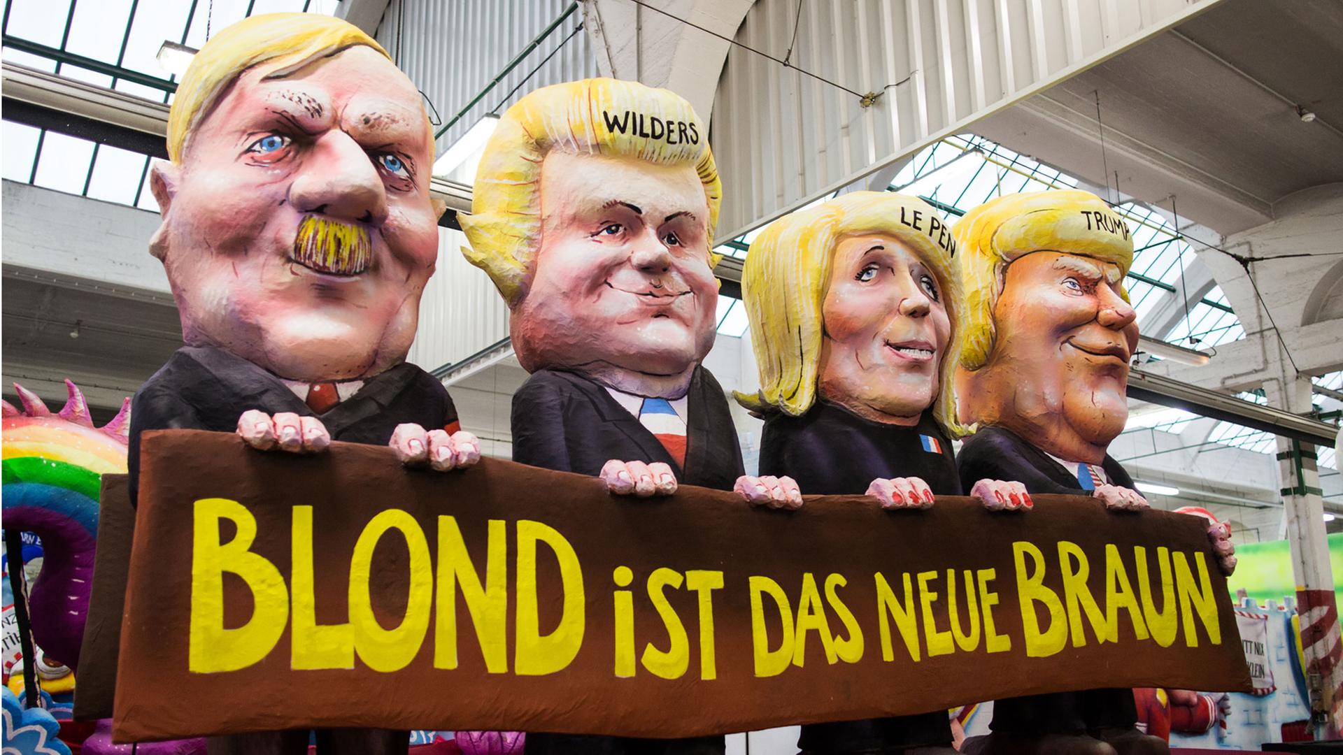 Ein Karnevalswagen zeigt am 27.02.2017 in Düsseldorf (Nordrhein-Westfalen) das Motiv "Blond ist das neue Braun". "Uns kritt nix klein - Narrenfreiheit, die muss sein" ist das Motto des Rosenmontagsumzugs im Jahr 2017. Ein Karnevalswagen zeigt am 27.02.2017 in Düsseldorf (Nordrhein-Westfalen) das Motiv "Blond ist das neue Braun". "Uns kritt nix klein - Narrenfreiheit, die muss sein" ist das Motto des Rosenmontagsumzugs im Jahr 2017.