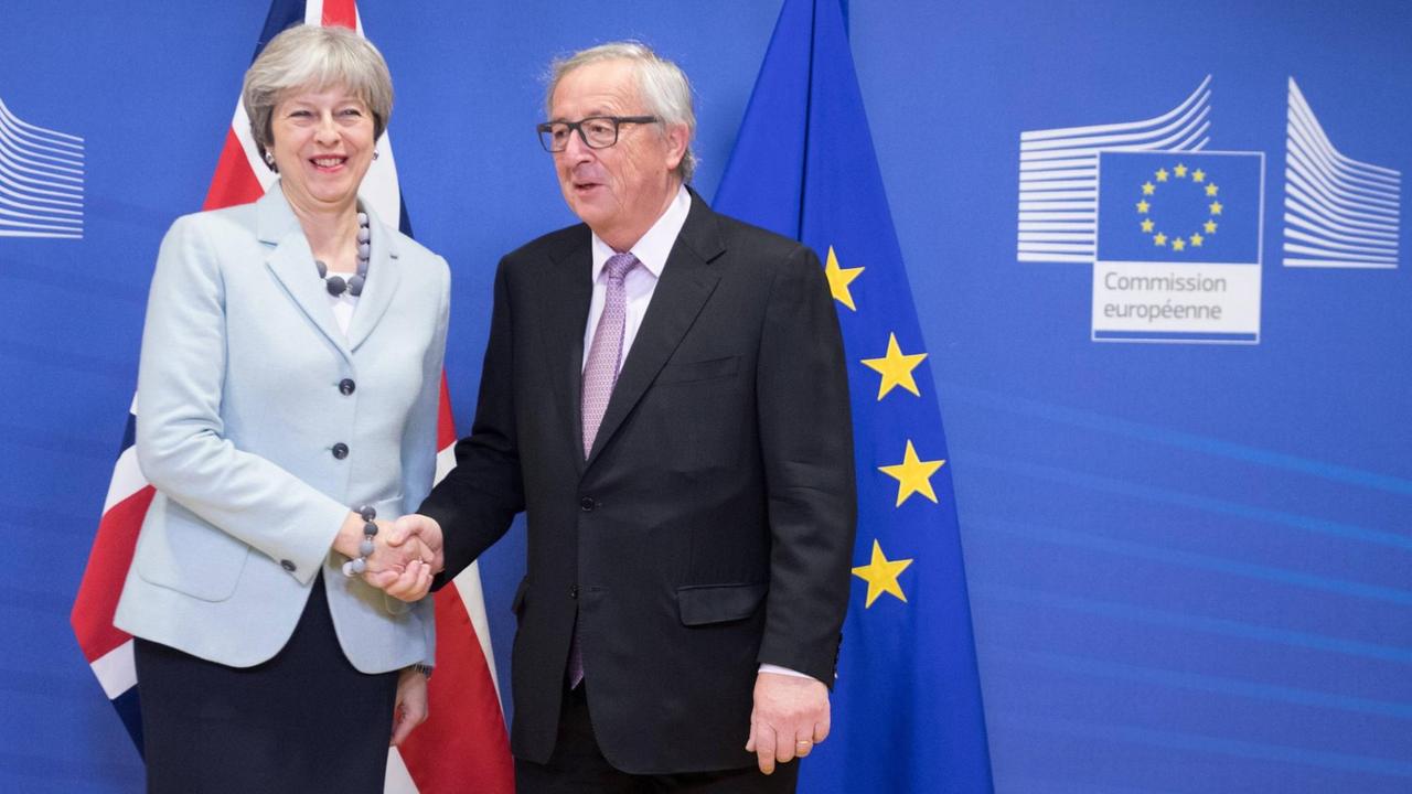 BRUSSELS, Dec. 8, 2017 -- European Commission President Jean-Claude Juncker (R) meets with British Prime Minister Theresa May in Brussels, Belgium, Dec. 8, 2017. The European Commission has found sufficient progress in the first phase of the Brexit talks and will recommend to the European Council to open the second phase, European Commission President Jean-Claude Juncker said Friday.